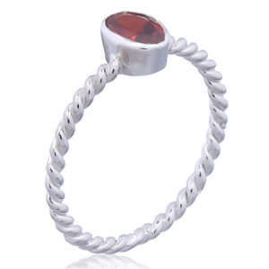A twisted wire silver ring oval red cz
