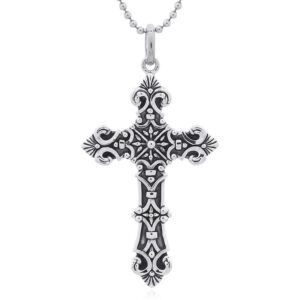 A sacred vintage ornate cross pendant