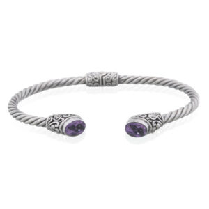 An amethyst in ovate bohemian hinged 925 silver bangle