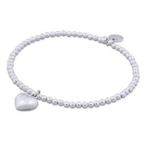 A sterling silver beads stretch bracelet with puffed heart charm