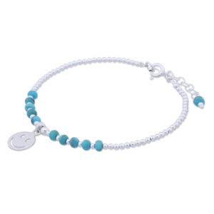 A happy face charm on turquoise and silver bead bracelet