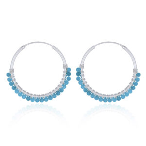 A pair of faceted blue apatite sterling silver hoop earrings