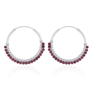 A pair of faceted garnet sterling silver hoop earrings