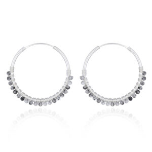 A pair of faceted rutilated quartz sterling silver hoop earrings