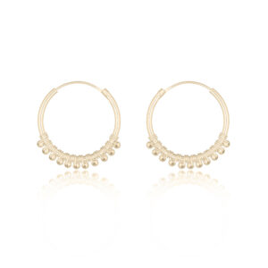 A pair of modern ethnic yellow gold plated hoop earrings