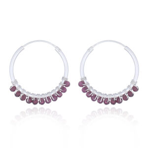 A pair of faceted garnet 925 silver hoop earrings
