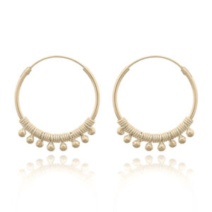 A pair of hippie beaded yellow gold plated hoop earrings