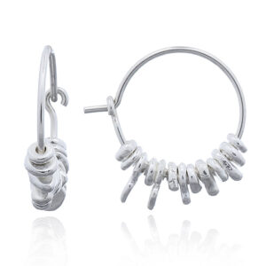A pair of asymmetric silver gravels in silver hoop earrings