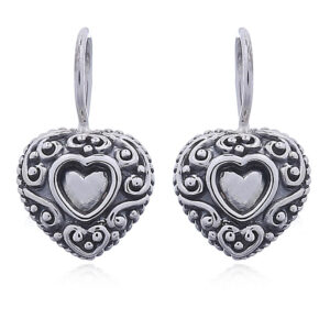 A pair of antiqued silver heart earrings embossed design