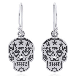 A pair of sugar skull silver dangle earrings heart eyes