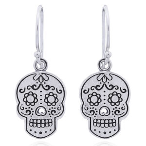 A pair of sugar skull silver dangle earrings perforated nose