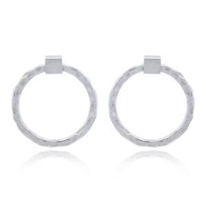 A pair of hammered doughnut silver stud earrings