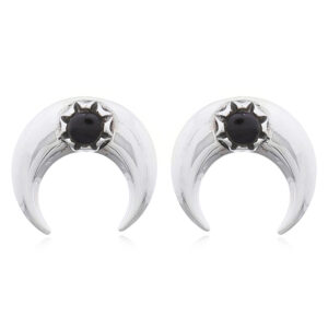 A pair of crescent moon stud earrings with synthetic black stone
