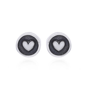 A pair of embossed heart 925 silver stud earrings