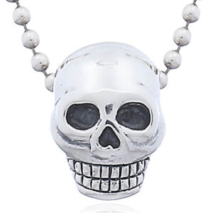 A polished sterling silver punk skull pendant
