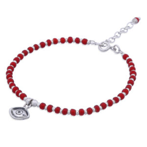 A silver evil eye bracelet round glass and silver beads