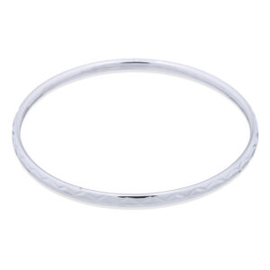 A silver bangle bracelet stamped angular pattern