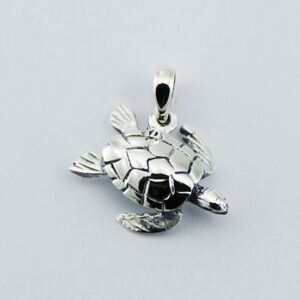 A highly polished sterling silver turtle pendant