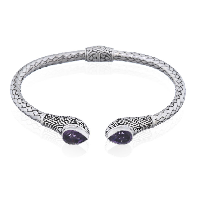A tear drop amethyst stone on bohemian hinged silver bangle