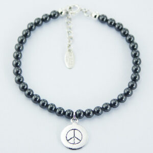 A swarovski crystal pearl bracelet stamped silver peace charm