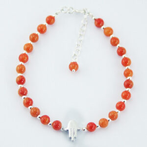A silver bead bracelet with polished silver hamsa charm
