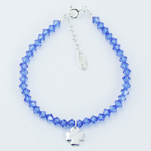 A swarovski bicone bracelet with four-leaf silver clover charm