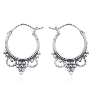 A pair of antiqued boho design hoop sterling silver earrings