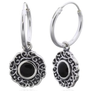 A pair of swirly ajoure sterling silver black stone hoop earrings