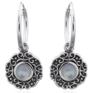 A pair of swirly ajoure sterling silver mother of pearl hoop earrings