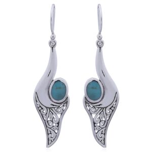 A pair of turquoise silver conch dangler earrings