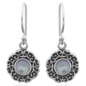 A pair of swirly ajoure sterling silver mother of pearl dangle earrings