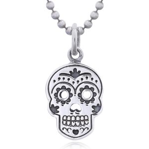 A sterling silver mexican skull pendant