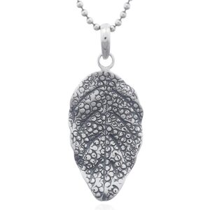 A 925 silver leaf pendant undulated profile packed circles surface
