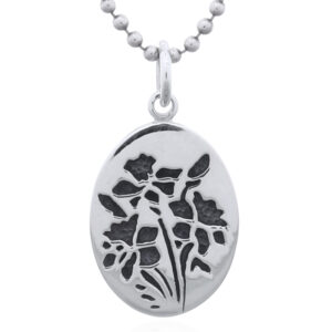 A carved flowers sterling silver pendant