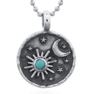 A sun, moon and star sterling silver synthetic green stone pendant