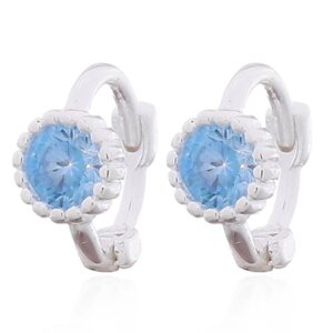 A pair of minimalist blue cz huggie 925 silver earrings