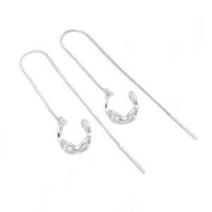 A pair of gucci link style cuff with long chain threader earrings