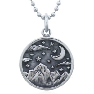 A 925 sterling silver oxidized starry night mountain scene pendant